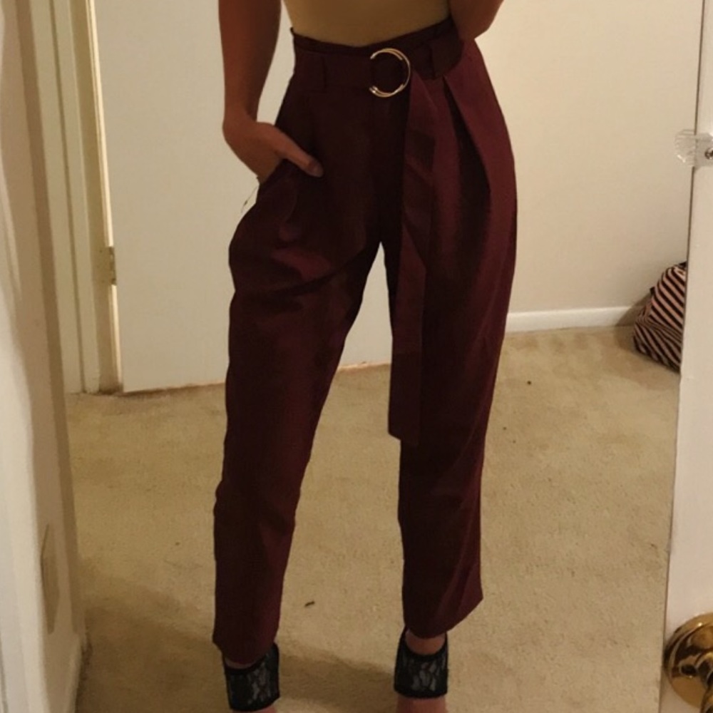 Burgundy pants and with matching belt